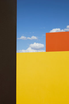 Watercolor buildings against blue sky