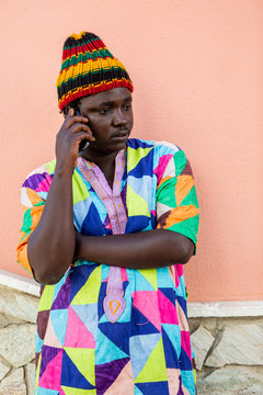 African man using mobile phone.