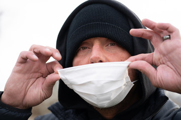 man wearing protective breathing mask to avoid germs