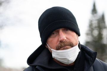 man wearing protective breathing mask to avoid germs