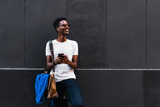African man using mobile phone - Powered by Adobe