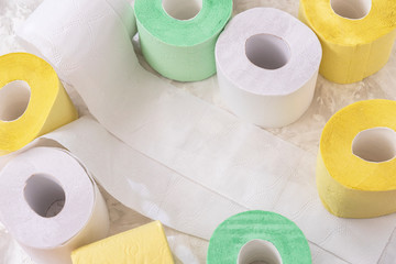 Set of colored toilet paper rolls of toilet paper , top view, copy space. Concept of problem with consumer essential goods, virus, hygiene, health