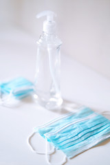 Coronavirus prevention medical  sterile masks and hand sanitizer gel for hand hygiene coronavirus protection. The concept of preventing the spread of the epidemic and treating  pandemic in quarantine 
