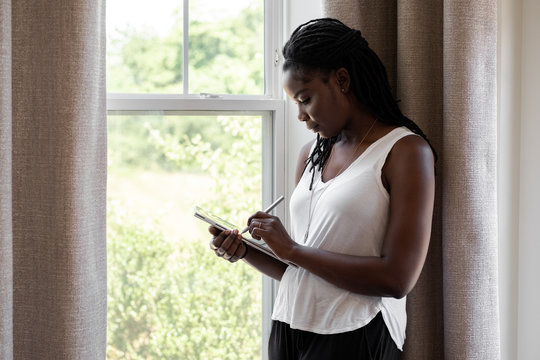 Woman drawing on a device
