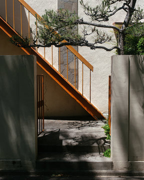 Entrance to a residence with a warm and zen garden like atmosphere.