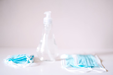 Coronavirus prevention medical  sterile masks and hand sanitizer gel for hand hygiene coronavirus protection. The concept of preventing the spread of the epidemic and treating  pandemic in quarantine 