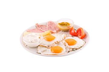 Three fried eggs garnished with cheese, ham and tomatoes. Photo taken on a white background. Dish of Montenegrin cuisine. Suitable for the restaurant menu.