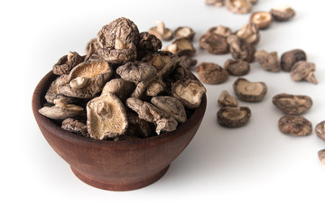 Dried Shitake Mushroom   into a wooden bowl
