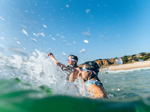 Kids splashing in the waves