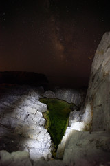 beautiful rocky beach by night of the Protected Marine Area Costa degli Infreschi and Masseta in...