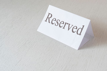 plate or paper board with a reserved word text in a restaurant inside