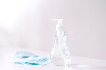 Coronavirus prevention medical  sterile masks and hand sanitizer gel for hand hygiene coronavirus protection. The concept of preventing the spread of the epidemic and treating  pandemic in quarantine 
