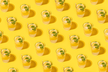 Refreshing lemon infused water with straws