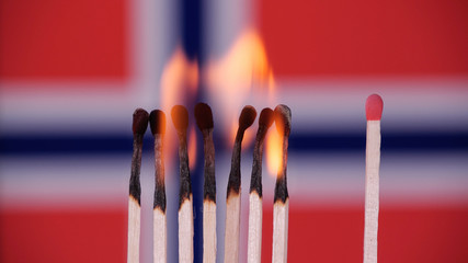 Stay at home, stop Coronavirus epidemic. Burning matches on Italy flag background. Concept:...