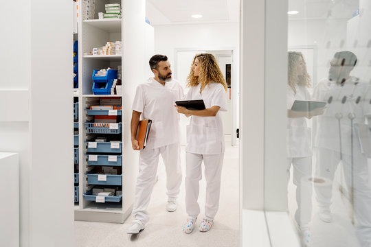 Medical staff walking and chatting in the hospital