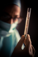Doctor hands holding a coronavirus COVID-19 positive test tube