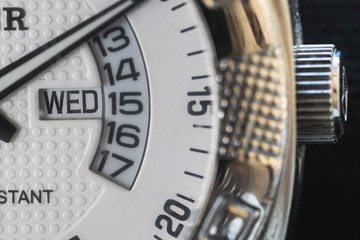 dial of a watch with a white face 