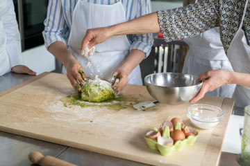 Kitchen class lesson with people cooking food