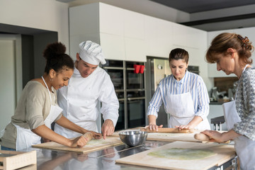 Preparing dough in a kitchen class