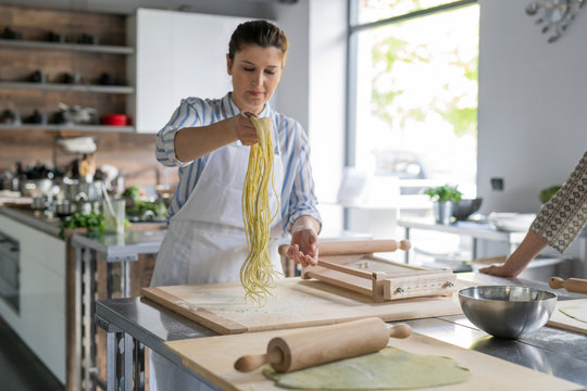 Making pasta during a kitchen lesson