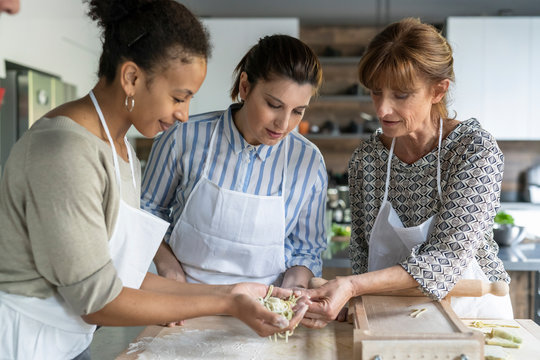 Making pasta during a kitchen lesson