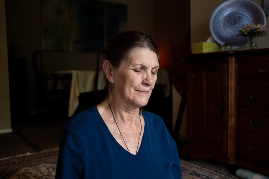 Elderly woman meditating