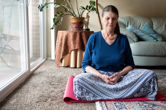 Elderly woman meditating