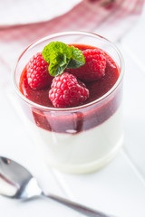 Italian dessert panna cotta with raspberries.