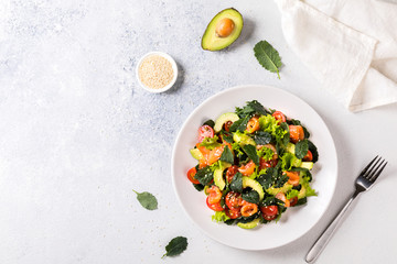 Salmon Salad with Vitamins in vegetables, herbs and avocado