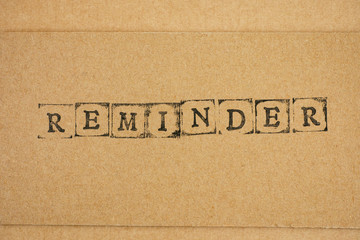 Cardboard with word Reminder