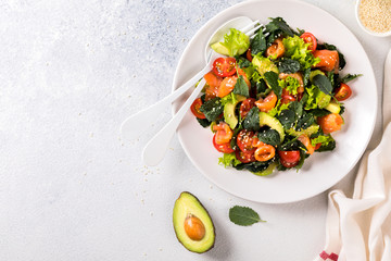 Salmon Salad with Vitamins in vegetables, herbs and avocado