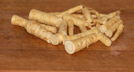 Sliced parsley roots in the process of cooking. beneficial and aromatic roots