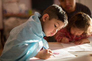 Little kid drawing at home