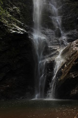 waterfall in brazilian rain forest with lake 