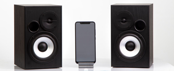 bookshelf speaker with smartphone isolate on white