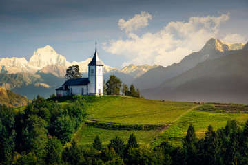 Landscape view of Jamnik church and generic mountains - composite image, Slovenia - obrazy, fototapety, plakaty