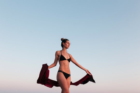 Woman with a red sarong