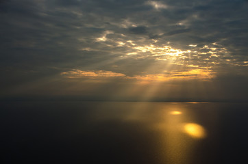 The rays of the sun break through the clouds