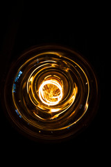 art of lighting of incandescent bulb. Close up. Vertical view