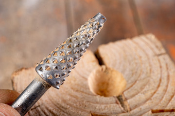 Countersinks for wood on a wooden table. Small carpentry work in the workshop.