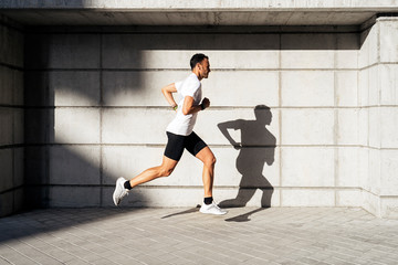 Handsome man running in the city.