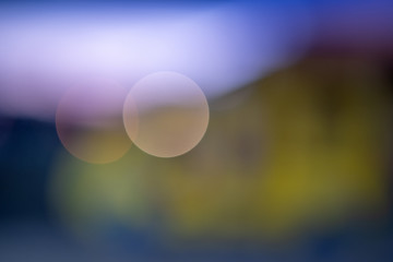 Bright colorful bokeh circles at night. Blurred city lights background.