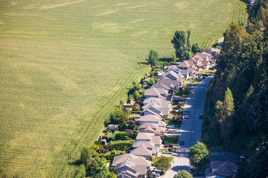 Urban development on the edge of a farm field
