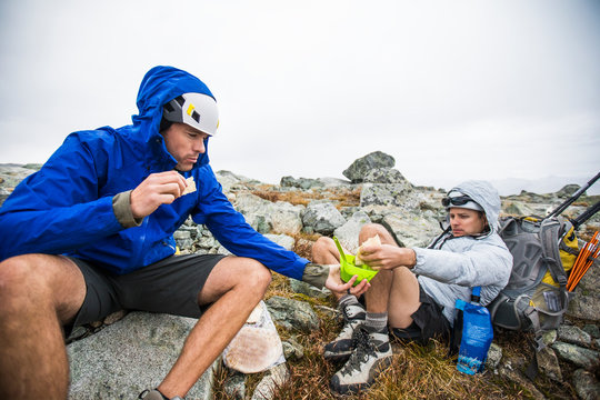 Climbers share food during a backpacking trip.