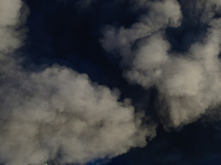 Billowing black smoke from a burning factory. Nature.