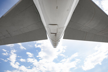 Rear view of jet airliner against blue sky