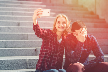 Woman makes selfie, but her boyfriend does not want to. Dependence on photo and social networking....