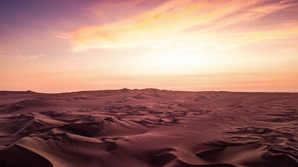 Fototapeta na wymiar Martian landscape view of the dessert with sand dunes during the orange - purple sunset in Peru. 