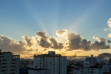 sunrise with clouds over city