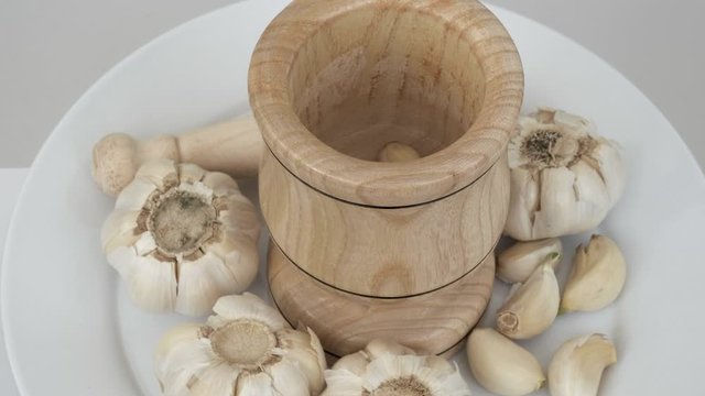 Garlic and wood garlic crusher on 360 degree rotating stand,